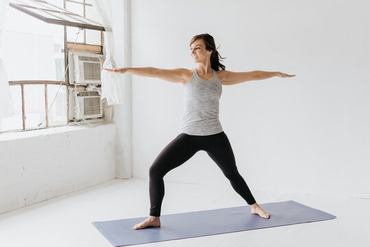 Woman practising yoga in studio