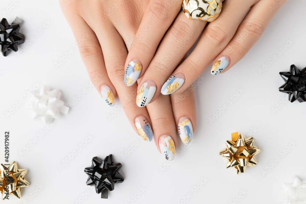 Poster young adult woman's hands with fashionable nails on white background. spring summer nail design.