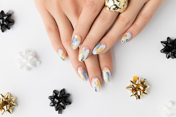 Young adult woman's hands with fashionable nails on white background. Spring summer nail design. - obrazy, fototapety, plakaty