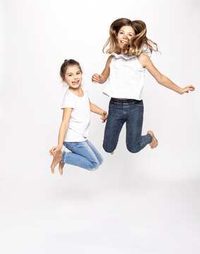 Happy Girls Jumping, White Background