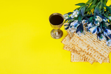 Passover symbols matzoh, red wine and flowers.