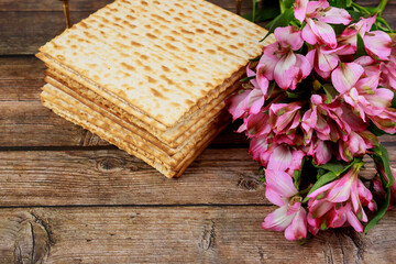 Fototapeta na wymiar Jewish matzah bread on wooden background. Passover holiday concept