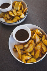 vegan mushroom gravy sauce with air fried potato wedges, healthy plant-based food