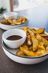 vegan mushroom gravy sauce with air fried potato wedges, healthy plant-based food
