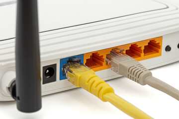 Wireless router with cables, isolated on white background
