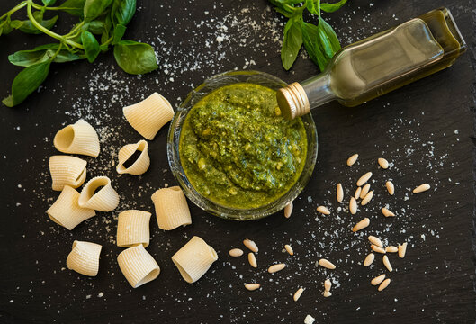 Pesto sauce, basil, pine nuts, rigatoni, cheese flakes
