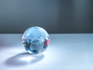 A glass globe of planet Earth illustrating global trade and networking.