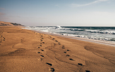 Footprints on sandy beach