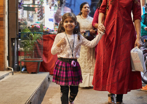 Mother and daughter shopping at bazaar