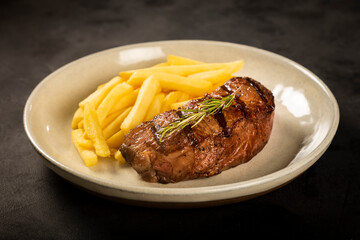 Grilled steak with french fries.