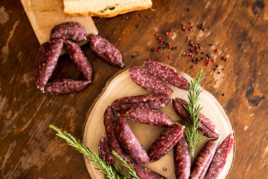 Strings of sausages, rosemary, peppercorn
