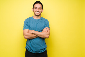 Latin young man making eye contact and smiling