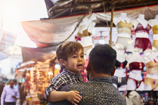 Father and son looking lost at bazaar