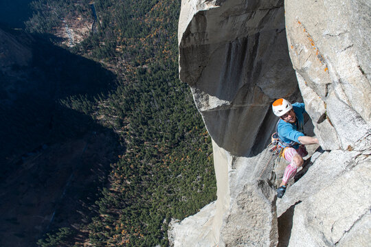 High angle view of mountaineer climbing up sheer wall of The Nose, El Capitan, Yosemite National Park.