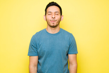 Hispanic young man thinking about delicious food