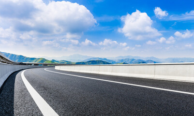 country road and green mountains in summer.