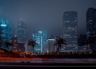 Fototapeta na wymiar Modern office buildings in Hong Kong at foggy night