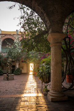 Convento de Santa Cruz de la Popa, historic convent building, courtyard with arches, cloisters and flowering shrubs