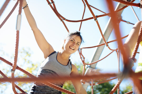 Woman Rope Climbing In Park