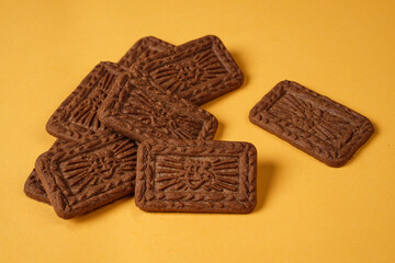 Square-shaped chocolate biscuits are suitable as a side snack to the breakfast menu. Start the morning with biscuits. Can be consumed by all ages from toddlers to the elderly. Stack of biscuits.