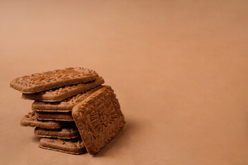 Square-shaped chocolate biscuits are suitable as a side snack to the breakfast menu. Start the morning with biscuits. Can be consumed by all ages from toddlers to the elderly. Stack of biscuits.