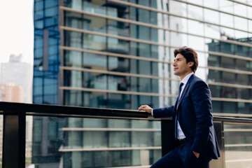 Businessman in front of office building