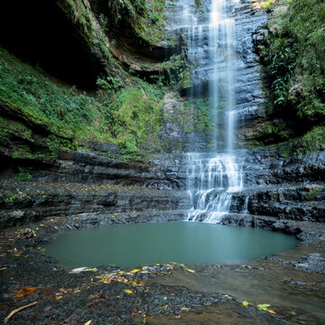 Cascadas de Juan Ciri at San Gil, a sheer cliff with water cascading over the stepped rock down into a pool