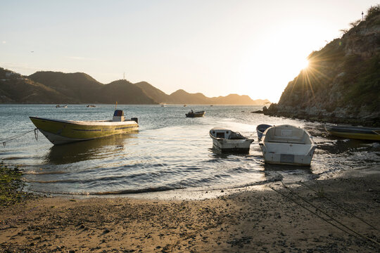 Boats moored on a lake near the Cascadas de Juan Ciri waterfall.