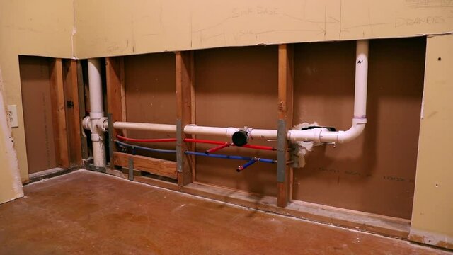 Plumbing pipes in kitchen renovation