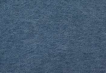 The background is made of a bright textured denim blue fabric.