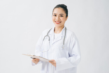 happy young woman doctor holding clipboard with documents over white background