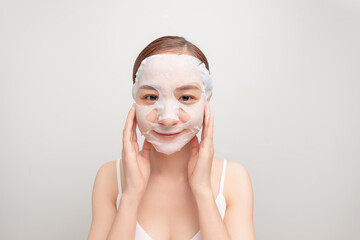 young woman in cosmetic mask on face