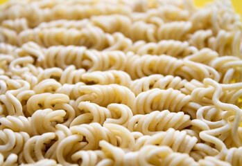 Noodles on a plate. Vermicelli in the shape of a square on a round plate.