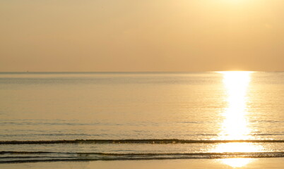 The golden light of the sunrise by the sea. Beaches in Thailand can be visited every season.