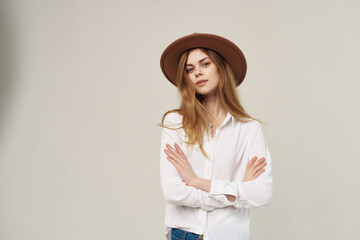 Pretty woman in hat white shirt elegant style fashion light background