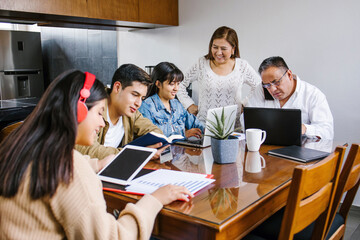 latin Family at home as the pandemic coronavirus (COVID-19) forces many employees and students to work and study from home in Latin America