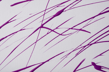 Thin purple lines and splashes drawn on white background. Abstract art backdrop with violet brush decorative stroke