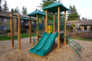 Fototapeta na wymiar Colorful children's playground in the public apartment areas.