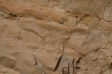 surface structure of brown shades of natural stone outdoors in nature