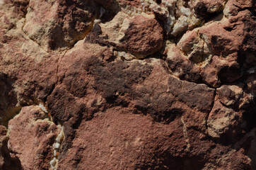 surface structure of brown shades of natural stone outdoors in nature