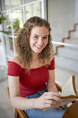 Beautiful girl.  smiling woman reading a book at home Study Concept reading book