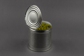 Open tin can on a gray background.