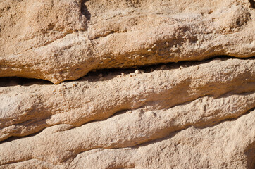 surface structure of brown shades of natural stone outdoors in nature