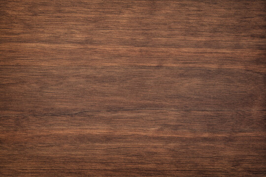 dark wood texture in walnut color. empty surface rustic table background. mahogany template for design