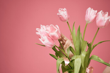 Bouquet of flowers as a gift holiday on March 8 pink background