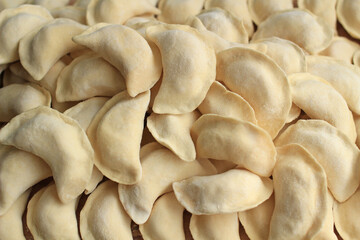 Homemade raw hand-made dumplings with potatoes