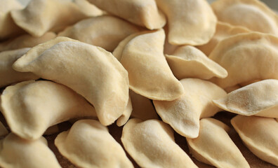 Homemade raw hand-made dumplings with potatoes