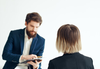 Business man for a job interview and a woman in a classic suit