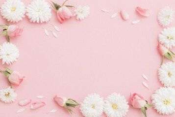 Fototapeta na wymiar pink and white flowers on pink paper background