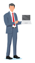 Business man holding laptop and pointing finger.